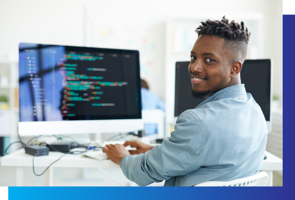 young african american male coding on computer